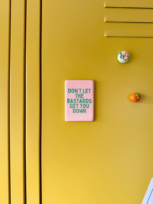 Don't Let The Bastards Get You Down | Ceramic Magnet