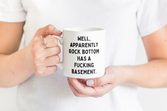 Ceramic / White Mugs | Well, Apparently Rock Bottom Has A Fucking Basement | Black | Ceramic Mug | Wisdom and Wonder Designs