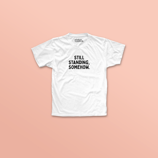 WISDOM & WONDER DESIGNS X POTS UK | Still Standing. Somehow | Organic Unisex T Shirt