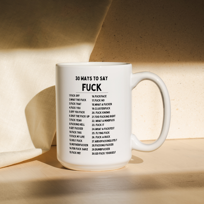 White mug with text on a wooden surface
