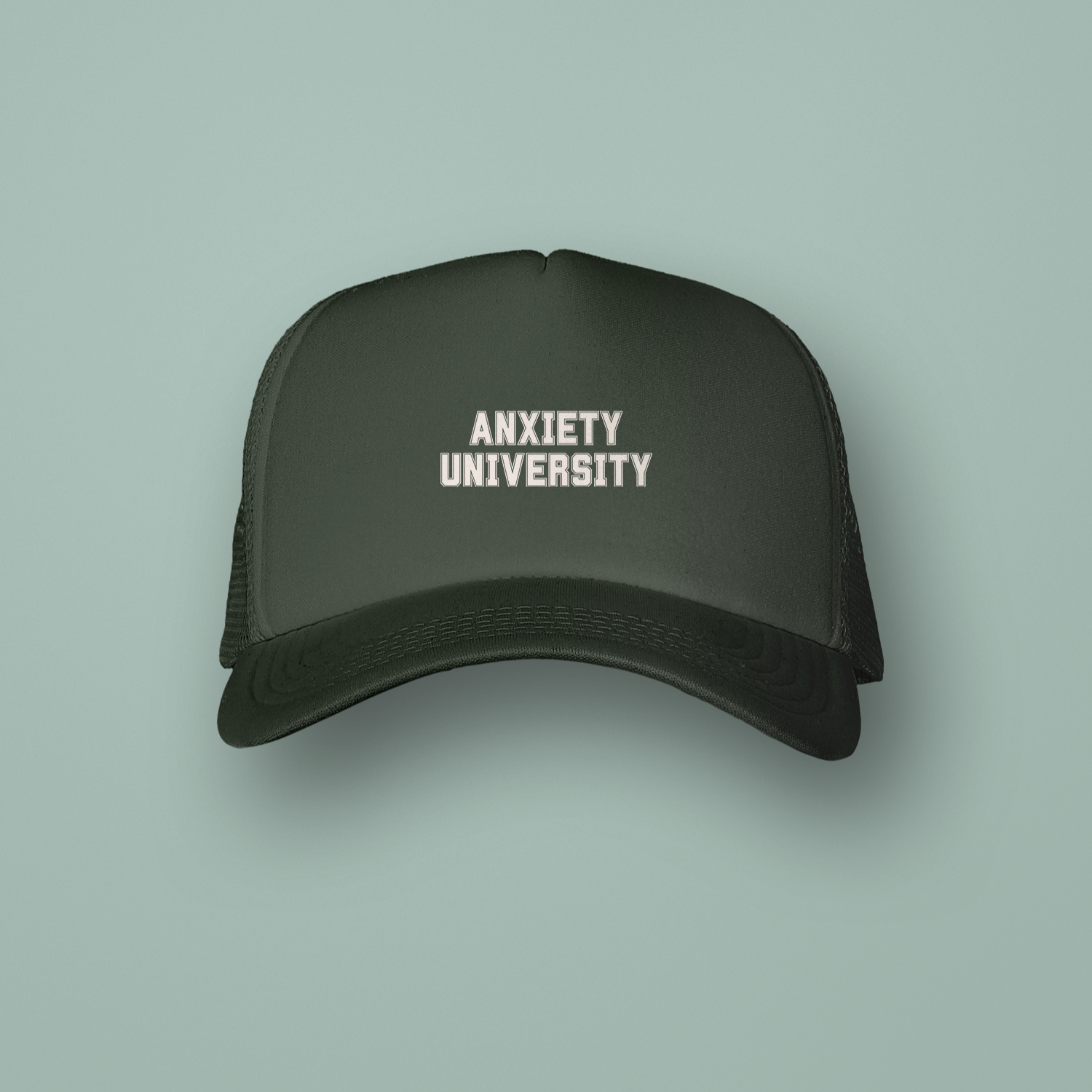 Black cap with 'ANXIETY UNIVERSITY' text on a light green background