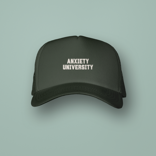 Black cap with 'ANXIETY UNIVERSITY' text on a light green background