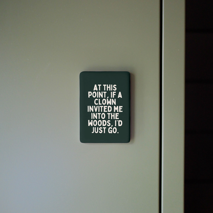 Sign on a door with humorous text about clowns and wood.