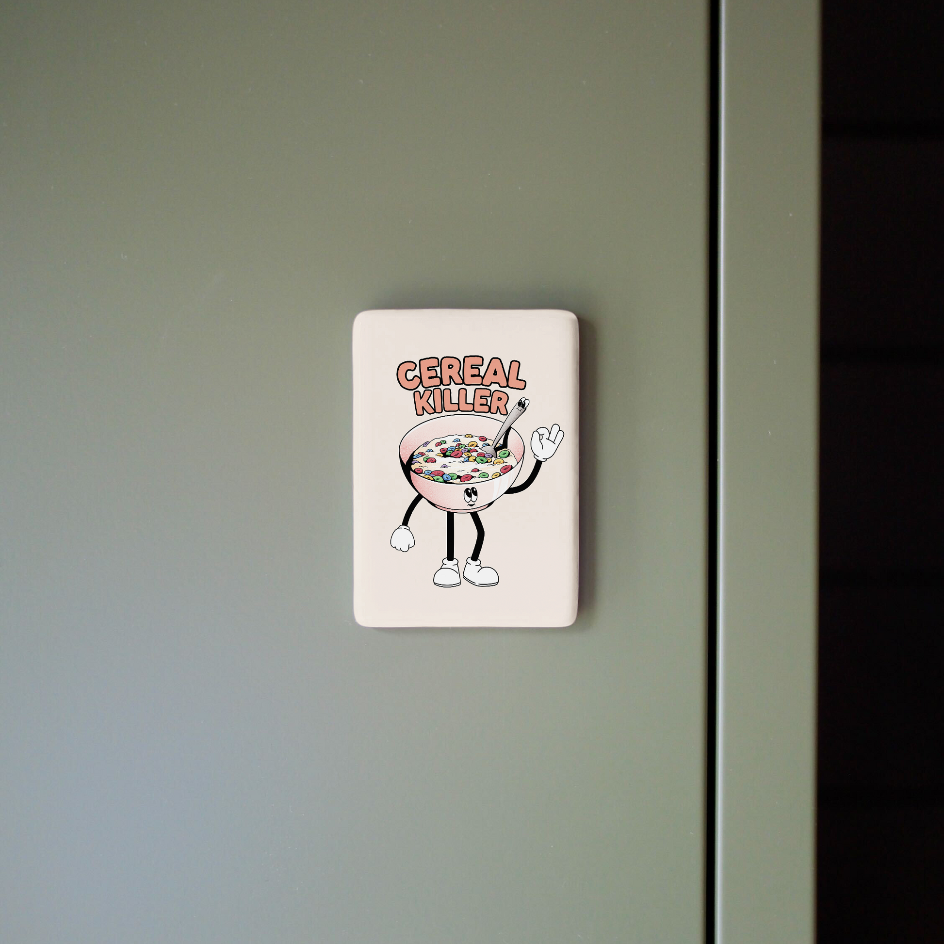 Sticker on a green door with a cartoon character holding a bowl of cereal.