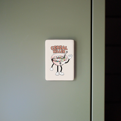 Sticker on a green door with a cartoon character holding a bowl of cereal.