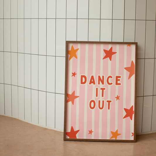 Framed poster with 'Dance It Out' text and star patterns on a tiled wall.