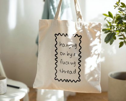 Hanging On By A Fucking Thread | Natural & Black | Organic Cotton Tote Bag