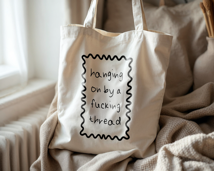 Hanging On By A Fucking Thread | Natural & Black | Organic Cotton Tote Bag