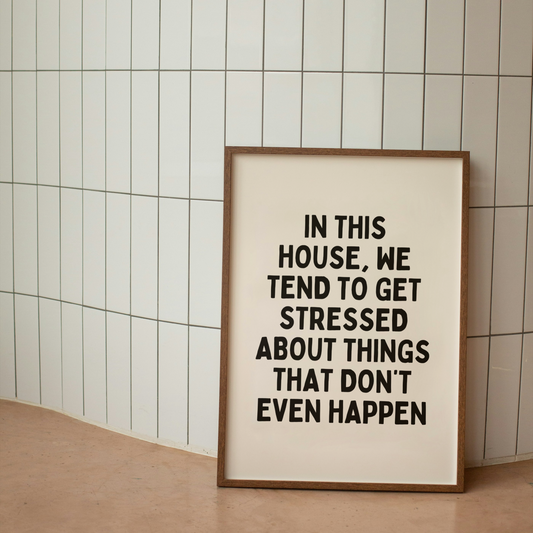 Framed poster with text on a tiled wall