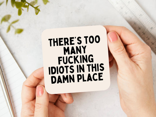 There's Too Many Fucking Idiots In This Damn Place | Black and Cream | Coaster