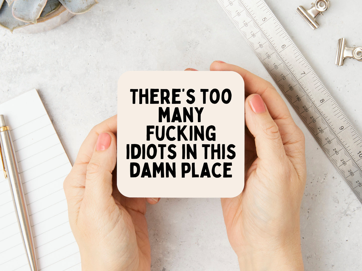 There's Too Many Fucking Idiots In This Damn Place | Black and Cream | Coaster