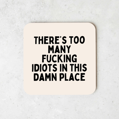 There's Too Many Fucking Idiots In This Damn Place | Black and Cream | Coaster