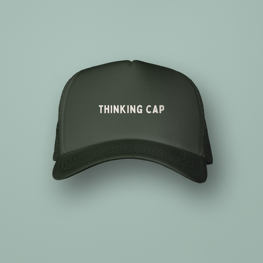 Black cap with 'THINKING CAP' text on a light green background