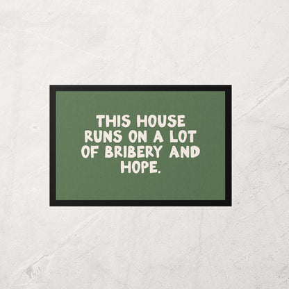 Green sign with white text on a textured wall
