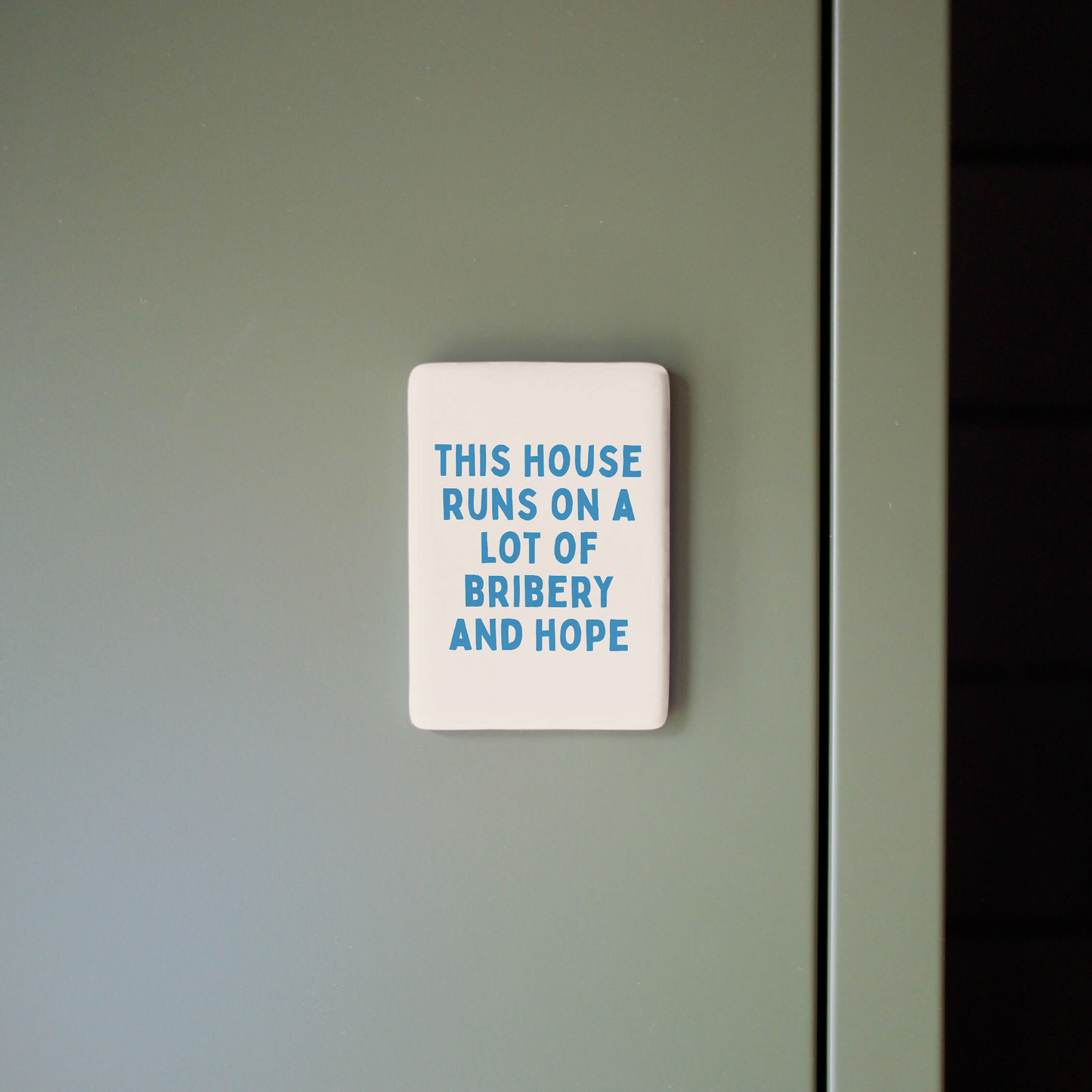 This House Runs On A Lot Of Bribery And Hope | Ceramic Magnet