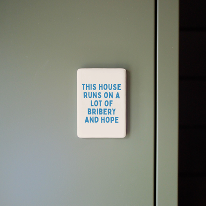 This House Runs On A Lot Of Bribery And Hope | Ceramic Magnet