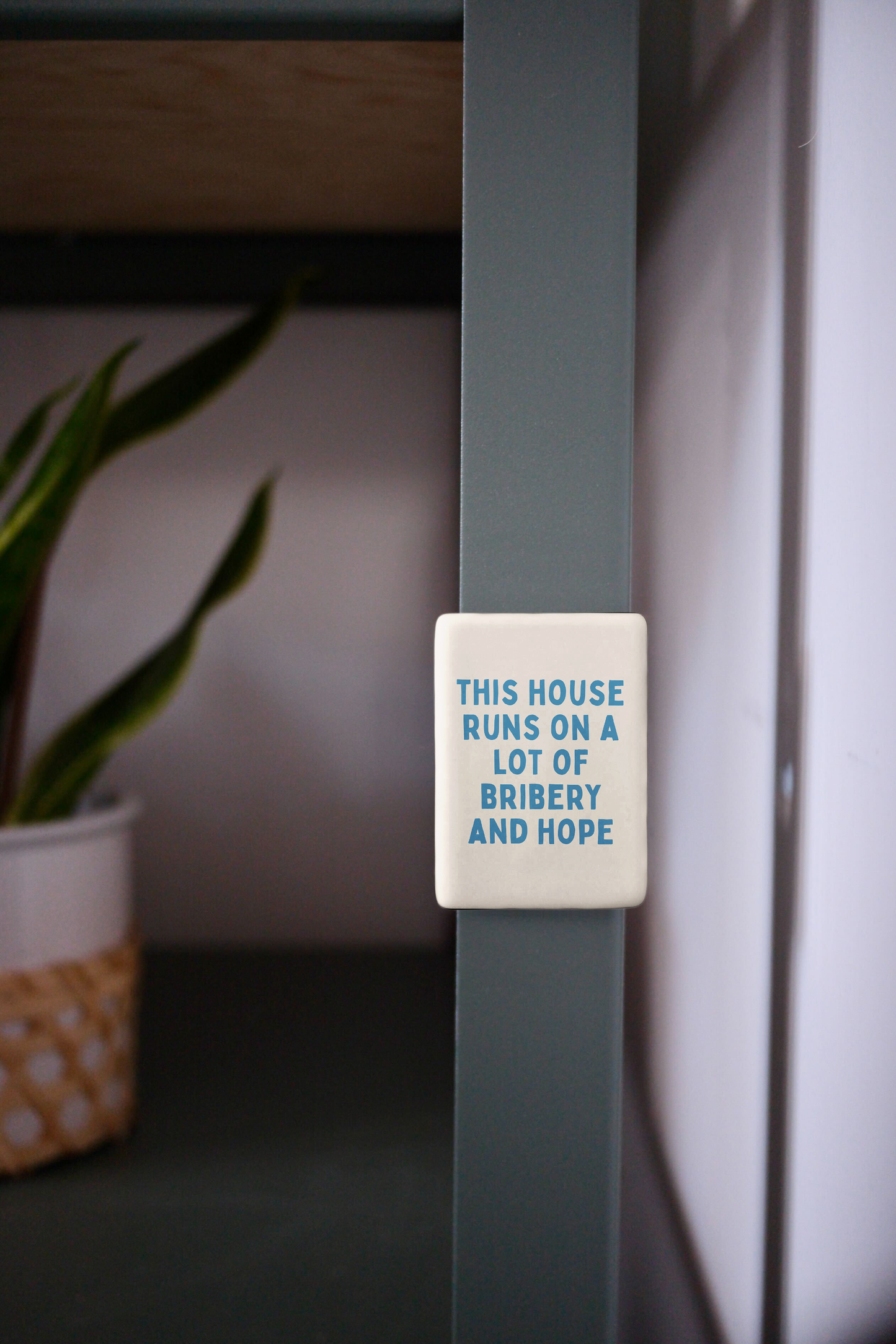 This House Runs On A Lot Of Bribery And Hope | Ceramic Magnet