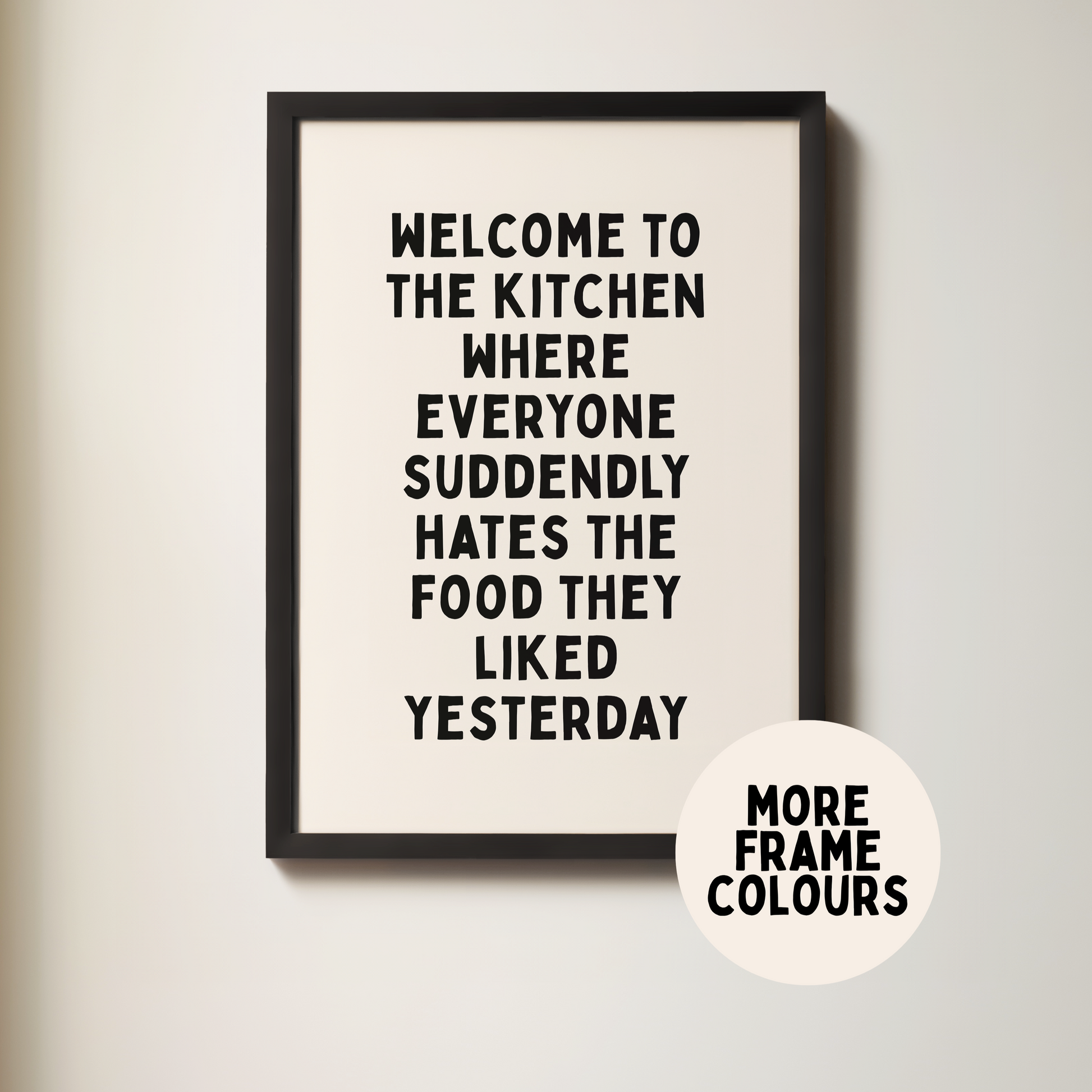 Framed poster with humorous kitchen quote on a light background