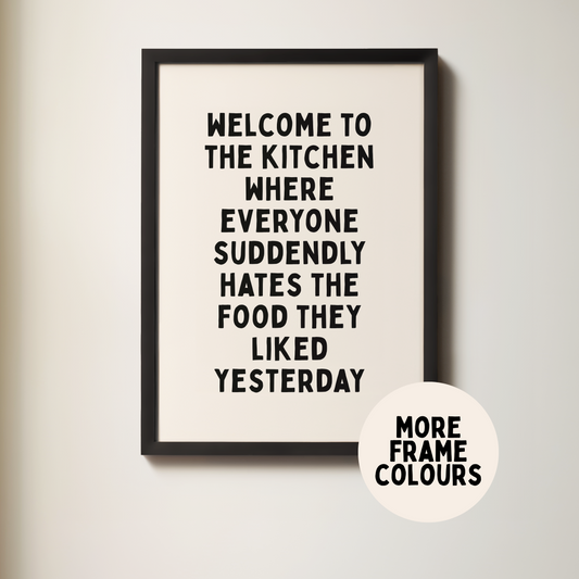 Framed poster with humorous kitchen quote on a light background