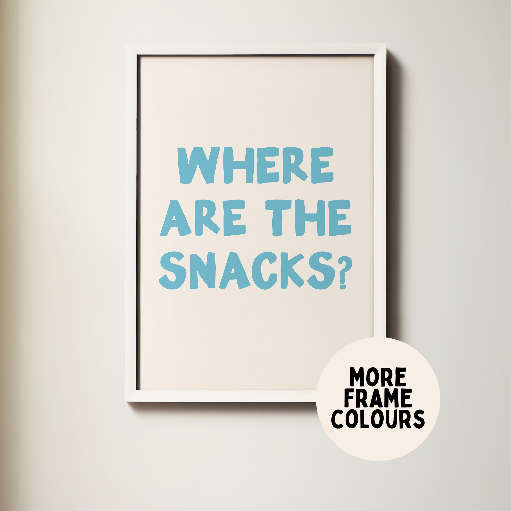 Framed poster with text 'WHERE ARE THE SNACKS?' on a light background
