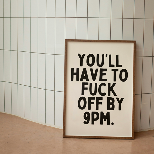 Framed poster with text on a tiled wall