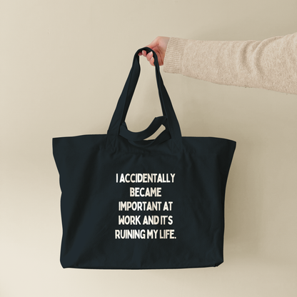 I Accidentally Became Important | Tote Bag (lifestyle-1-18551_I-Accidentally-Became-Important-At-Work_STAU117_Black_Tote-Bag.png)