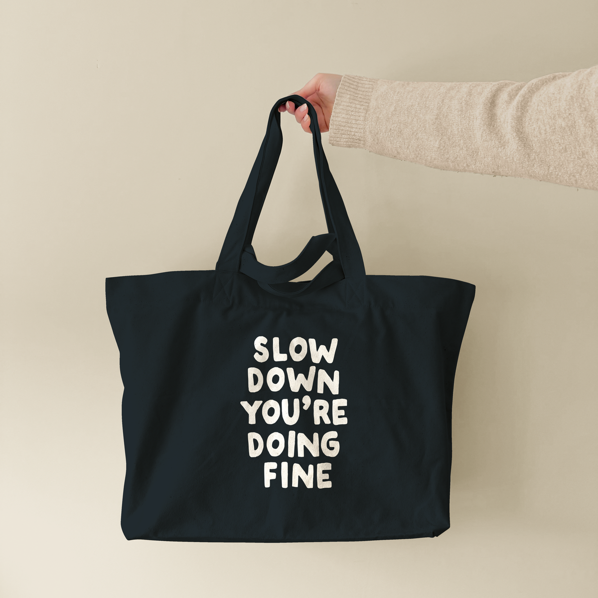 Slow Down You're Doing Fine | Tote Bag (lifestyle-1-18765_Slow-Down-You're-Doing-Fine_STAU117_Black_Tote-Bag.png)