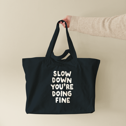 Slow Down You're Doing Fine | Tote Bag (lifestyle-1-18765_Slow-Down-You're-Doing-Fine_STAU117_Black_Tote-Bag.png)