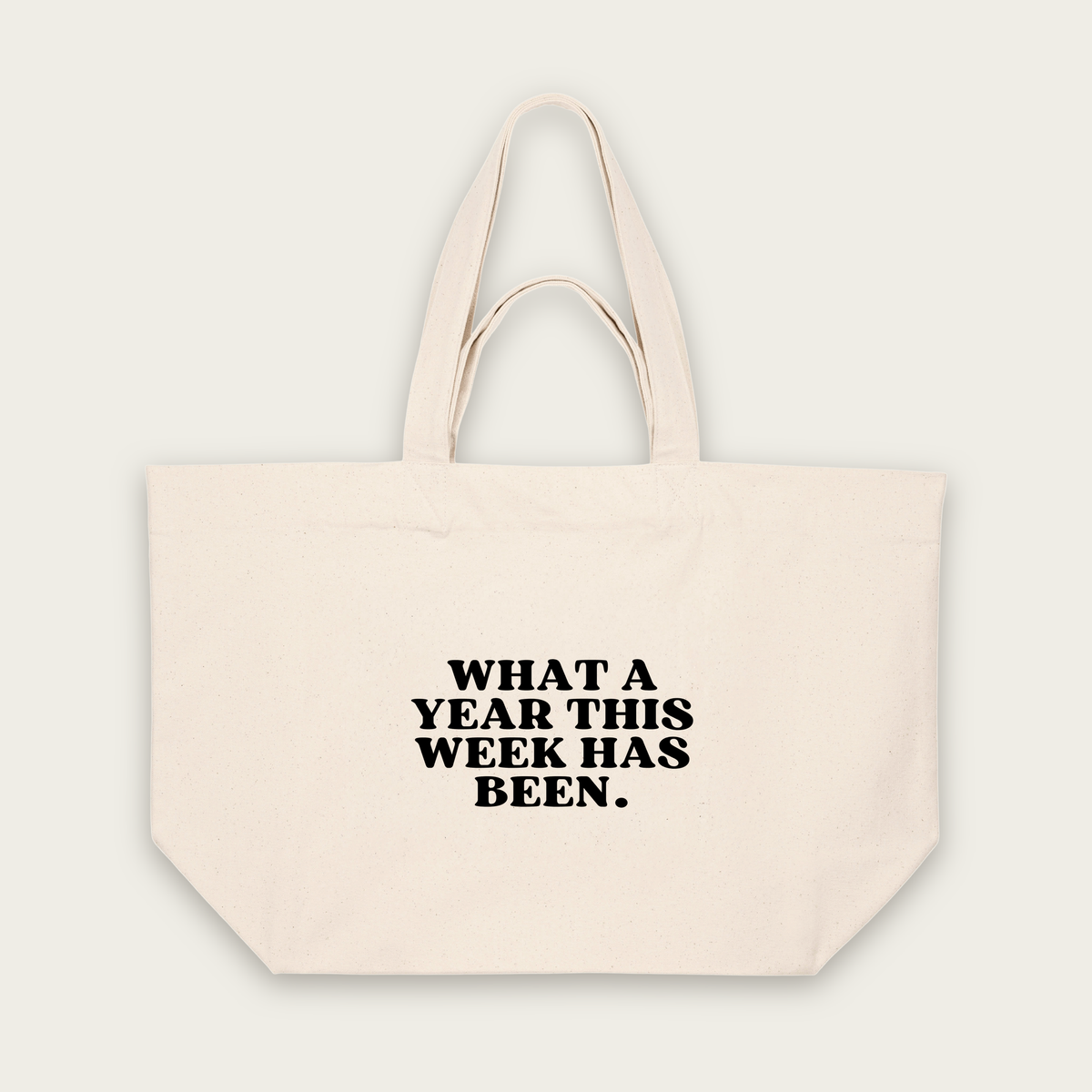What A Year This Week Has Been | Tote Bag in Natural Raw (18882_What-A-Year-This-Week-Has-Been_STAU117_Natural-Raw_Tote-Bag_Mockup.png)